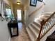 Elegant entryway with staircase and tiled flooring at 2143 Victoria Dr, Davenport, FL 33837