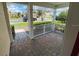 Covered front porch with brick pavers and white railings at 2143 Victoria Dr, Davenport, FL 33837