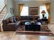 Spacious living room featuring a large sectional sofa and tile floors at 2143 Victoria Dr, Davenport, FL 33837