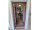 Bright entryway with red door and view into the living area at 2143 Victoria Dr, Davenport, FL 33837