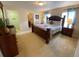 Main bedroom with king-size bed and ensuite bathroom at 2143 Victoria Dr, Davenport, FL 33837