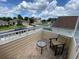 Private balcony with brick flooring and comfortable seating at 2143 Victoria Dr, Davenport, FL 33837
