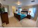 Main bedroom with large bed and ensuite bathroom at 2143 Victoria Dr, Davenport, FL 33837