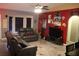 Spacious living room with tiled floors and a red accent wall at 624 Gull Dr, Poinciana, FL 34759