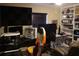 Home office with gaming setup and built-in shelving at 624 Gull Dr, Poinciana, FL 34759