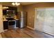 Modern kitchen with stainless steel appliances and wood flooring at 624 Gull Dr, Poinciana, FL 34759