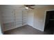 Bright bedroom with built-in shelving and hardwood floors at 624 Gull Dr, Poinciana, FL 34759