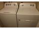Laundry room with side-by-side washer and dryer at 624 Gull Dr, Poinciana, FL 34759