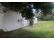 Side of house with AC unit and partial view of backyard at 624 Gull Dr, Poinciana, FL 34759