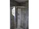 Clean shower with gray tile and built-in shelving at 624 Gull Dr, Poinciana, FL 34759