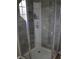 Modern shower with gray tile and built-in shelving at 624 Gull Dr, Poinciana, FL 34759