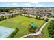 Community dog park with fenced area and shaded seating at 500 Playa Dr, Davenport, FL 33837