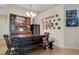 Charming dining area with a wooden table, bench seating, and decorative plates at 500 Playa Dr, Davenport, FL 33837