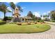 Gated community entrance with landscaping and water features at 500 Playa Dr, Davenport, FL 33837