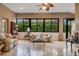 Bright sunroom with tiled floor and comfortable seating at 500 Playa Dr, Davenport, FL 33837
