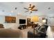 Open living space with kitchen views and a ceiling fan at 500 Playa Dr, Davenport, FL 33837