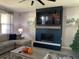 Spacious living room showcasing a contemporary fireplace and media wall at 2867 Matera Dr, St Cloud, FL 34771