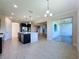 Open kitchen features island, breakfast nook, and access to outdoor patio at 3510 Mediterra Dr, Clermont, FL 34711