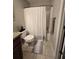 Bathroom with toilet, shower, and updated vanity at 834 S Donnelly St, Eustis, FL 32726