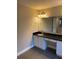 Bathroom boasts a vanity with granite countertop at 11460 Chateaubriand Ave, Orlando, FL 32836