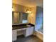 Elegant bathroom featuring double sinks, a soaking tub, and shower at 11460 Chateaubriand Ave, Orlando, FL 32836