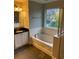 Primary bathroom with soaking tub and double vanity at 11460 Chateaubriand Ave, Orlando, FL 32836