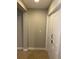 Clean basement hallway with neutral walls and carpet at 11460 Chateaubriand Ave, Orlando, FL 32836