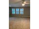 Large main bedroom with neutral walls and carpet at 11460 Chateaubriand Ave, Orlando, FL 32836