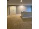 Open loft area with plush carpeting at 11460 Chateaubriand Ave, Orlando, FL 32836