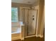 Bathroom with a shower and bathtub at 11460 Chateaubriand Ave, Orlando, FL 32836