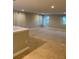 Spacious bonus room with neutral carpeting and multiple windows at 11460 Chateaubriand Ave, Orlando, FL 32836