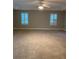 Spacious primary bedroom with carpet flooring and plantation shutters at 11460 Chateaubriand Ave, Orlando, FL 32836