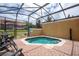 Relaxing screened-in spa with patio furniture at 8545 Bay Lilly Loop, Kissimmee, FL 34747