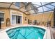 Private screened pool and patio furniture at 8545 Bay Lilly Loop, Kissimmee, FL 34747