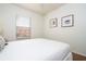 Simple bedroom with a double bed and a window with blinds at 8545 Bay Lilly Loop, Kissimmee, FL 34747