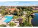 Community pool and lake with gazebo and lush landscaping at 8545 Bay Lilly Loop, Kissimmee, FL 34747