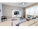 Living room with contemporary furniture and large TV at 5144 Adelaide Dr, Kissimmee, FL 34746