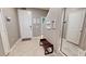 Bright entryway with bench and mirror at 5144 Adelaide Dr, Kissimmee, FL 34746