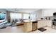 Open concept kitchen with island and stainless steel appliances at 5144 Adelaide Dr, Kissimmee, FL 34746