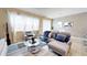 Spacious living room with comfortable seating and large windows at 5144 Adelaide Dr, Kissimmee, FL 34746