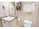 Bathroom featuring granite countertop and white cabinetry at 5144 Adelaide Dr, Kissimmee, FL 34746