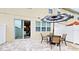 Private patio with table, chairs, and umbrella at 5144 Adelaide Dr, Kissimmee, FL 34746
