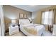 Cozy bedroom with queen-size bed and neutral color palette at 5144 Adelaide Dr, Kissimmee, FL 34746