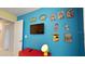 ' bedroom with superhero-themed decor and mounted TV at 5144 Adelaide Dr, Kissimmee, FL 34746