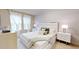 Main bedroom with king bed and soft color palette at 5144 Adelaide Dr, Kissimmee, FL 34746