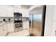 Modern kitchen with stainless steel appliances and white cabinets at 5144 Adelaide Dr, Kissimmee, FL 34746