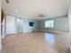 Open living room with tile flooring and ceiling fan at 3510 Mediterra Dr, Clermont, FL 34711