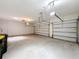 Bright and airy two-car garage with overhead lighting at 3510 Mediterra Dr, Clermont, FL 34711