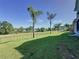 Landscaped backyard with lake view and privacy fence at 3510 Mediterra Dr, Clermont, FL 34711