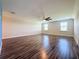 Spacious bonus room with wood-look flooring and ceiling fan at 3510 Mediterra Dr, Clermont, FL 34711